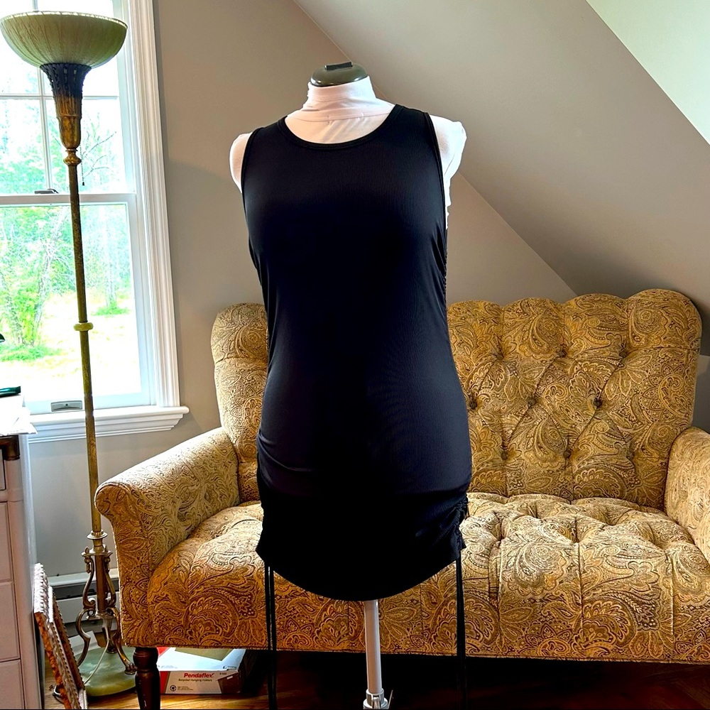 Black sleeveless rib knit dress.